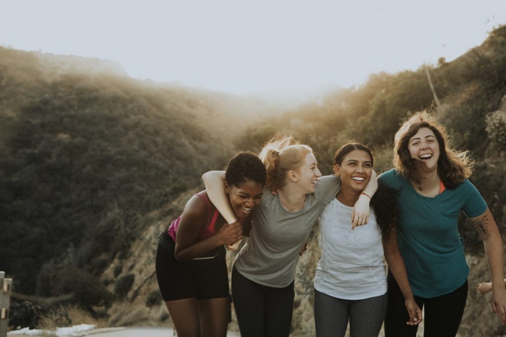 happy women enjoying the social benefits of exercise